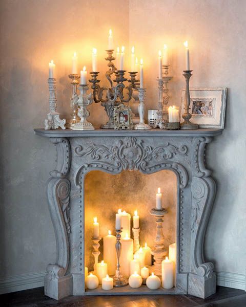 Faux vintage fireplace with candles all over