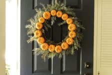 04 faux pumpkins and greenery wreath