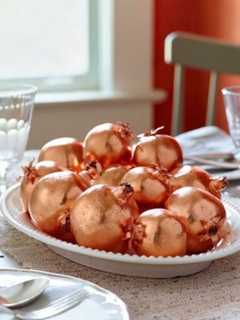 faux pomegranates covered with copper spray paint