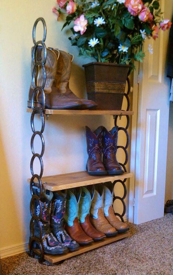 shoe shelf with boards and horseshoes