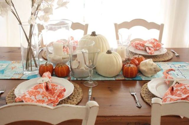 rustic seaside tablescape with coral printed napkins, shells and pumpkins