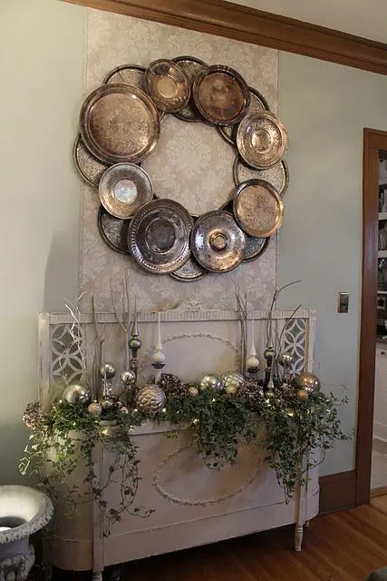 oversized silver wreath made from vintage silver trays and chargers
