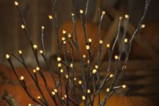09 orange LED pre-lit branches placed into pumpkins for fall displays