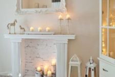 09 whitewashed fireplace with candles and candle lanterns