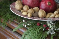 11 nuts and pomegranates on a dish for home decor