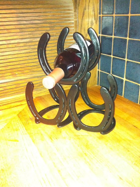 wine bottle holder of several horsehoes