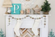 12 Christmas faux fireplace and mantel decor with reclaimed wood, potted fir and pinecones