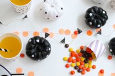 12 black and white party table with polka dot pumpkins and garlands