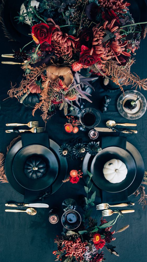 chic moody Halloween tablescape with bold florals