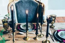 13 elegant and moody Halloween table with purple flowers and black candles