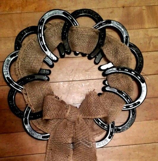 black horseshoes and burlap as a wreath