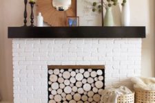 16 install a wood log panel to make your fireplace cozier
