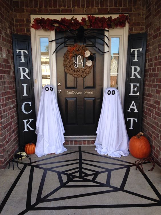 trick or treat signs and simple ghosts made of sheets