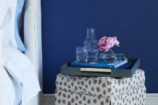 17 a skirted ottoman topped with a shagreen tray makes for a fun, unfussy nightstand alternative