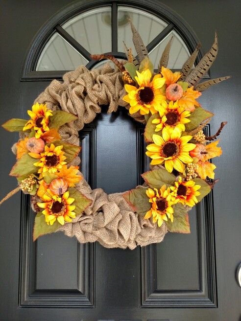 burlap wreath with sunflowers and feathers