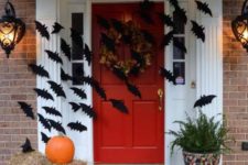17 easy front door decor with cardboard bats attached to it