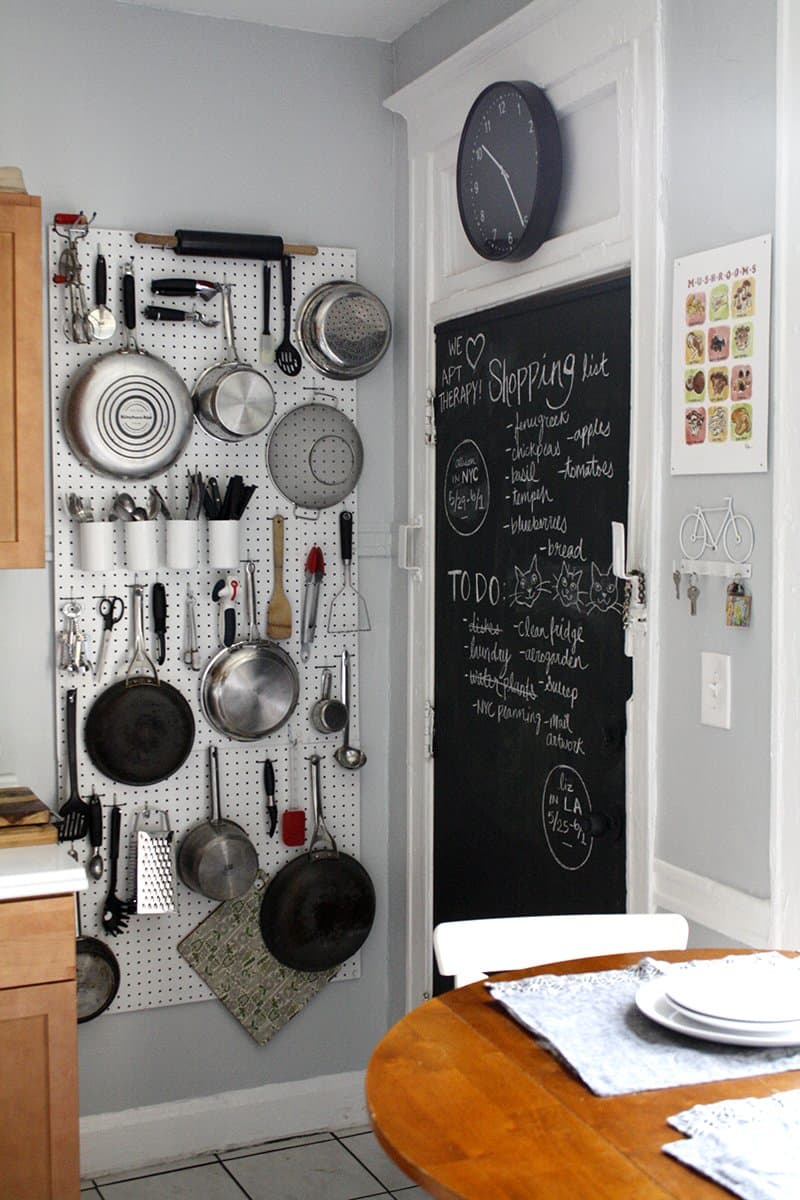 a pegboard for hanging various kitchen stuff and tableware is ideal for the tiniest kitchen