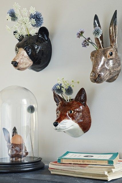 colorful faux animal heads to use as wall-mounted vases