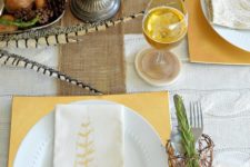 25 whimsy table with burlap, feathers, pinecones and printed napkins