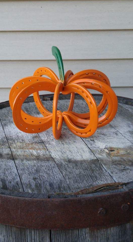 faux pumpkin made of painted horseshoes