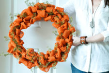 DIY bold orange burlap wreath with faux greenery