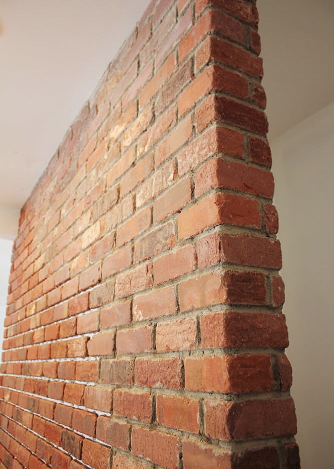 DIY real brick wall (via www.apartmenttherapy.com)