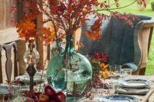 harvest-inspired tablescape with fall leaves and fruit and chinoiserie