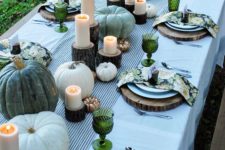 pumpkins, gourds, wood and candles for a cool and fresh table