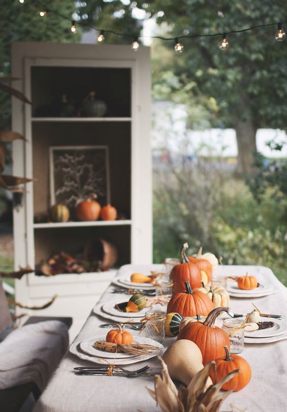 traditional table decor with corn, pumpkins and gourds