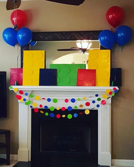 colorful fireplace decor with cardboard legos and garlands