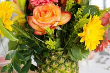 03 a pineapple can be used instead of a vase to make a bold flower centerpiece