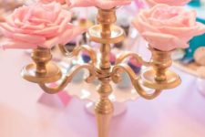 04 centerpiece of a gold candle holder and silk pink roses