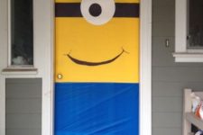 04 cover the door or doors with colored paper and add eyes to turn them into minions