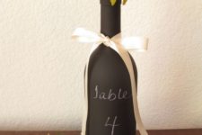 06 chalkboard wine bottle with white ribbon and flowers
