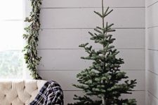 a small Christmas tree in a vintage farmhouse crate is a great idea for a rustic or a farmhouse space