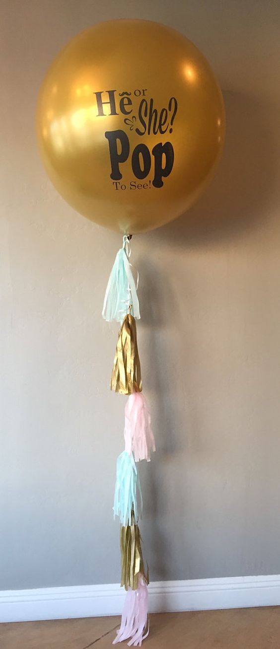 gender reveal balloon with colorful tassels
