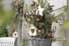 for <a href='https://www.shelterness.com/17-scandinavian-inspired-christmas-diys-for-your-home/'>Scandinavian style place your tree</a> into a oven basket, add some pinecones, berries and a couple of ornaments
