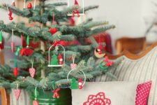 11 green and red ornaments and a green bucket for traditional and rustic decor