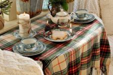 11 rustic table deccor with evergreens, pinecones and candles