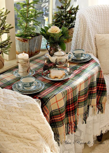 rustic table deccor with evergreens, pinecones and candles