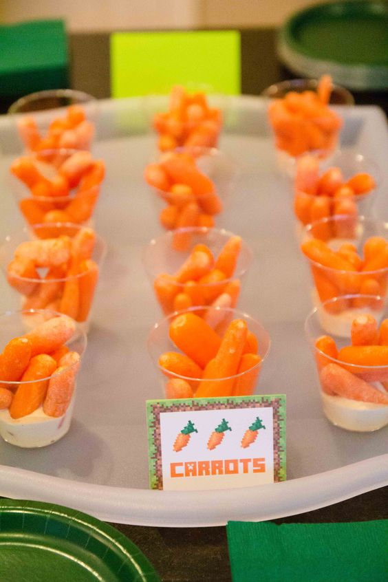 carrots in little cups with ranch dressing at the bottom for dipping
