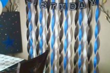 15 paper wall hangings with a garland and stromtroopers balloons