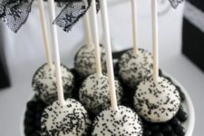 17 black and white cake pops and candies