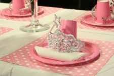 18 pink table setting with a wand and a tiara