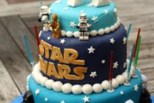 19 bold Star Wars cake with masks and topped with R2D2