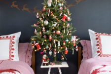 a small tree decorated with colorful ornaments is a great idea for a kid’s room, let them choose the decor themselves