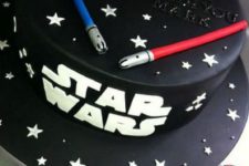 21 chic black Star Wars cake topped with light sabers