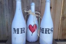 23 whitewashed wine bottle centerpiece for a wedding