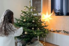 a Christmas tree done with lights and metallic ornaments looks very cool and fresh and is ideal for a Scandi space