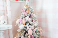 a lovely pastel christmas tree in a corner